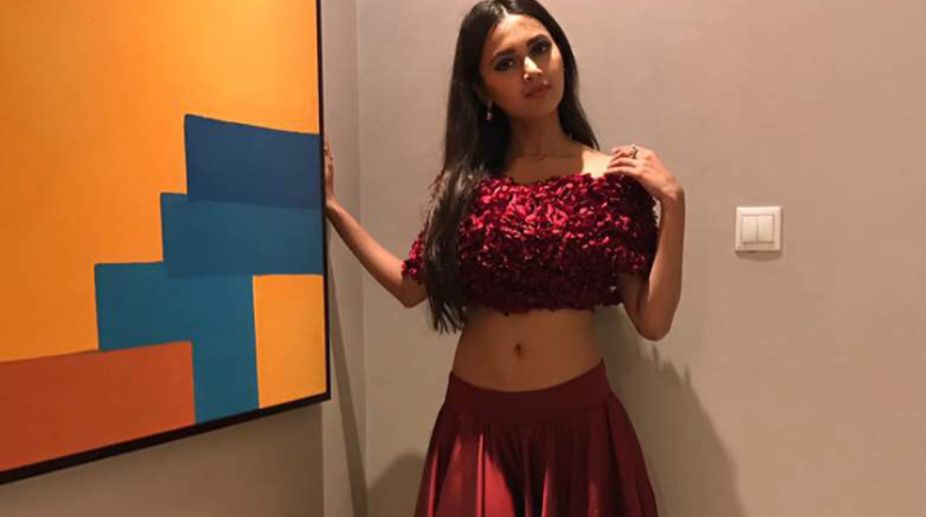 Tejasswi Prakash hooked to books