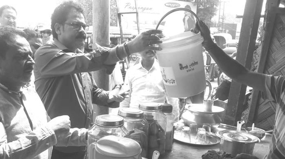 Raiganj shops given dust bins to keep town clean