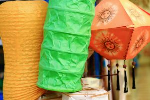 Colorful paper lanterns of nepalese style for sale hanging at the door of a shop on Lakeside Street in Pokhara-Kaski distr.-Gandaki zone-Nepal.