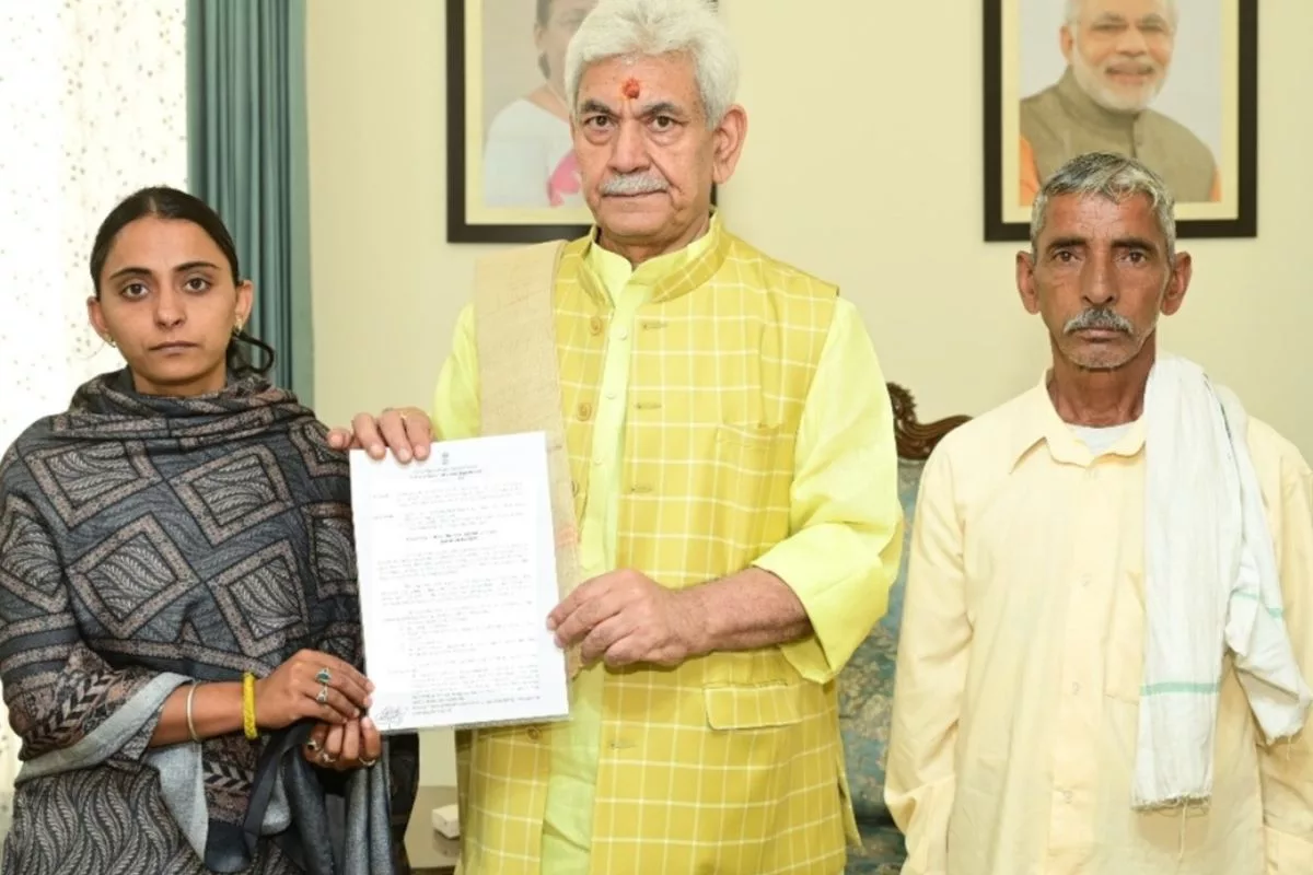 LG Sinha hands job letter to sister of bus conductor killed in J&K terror attack